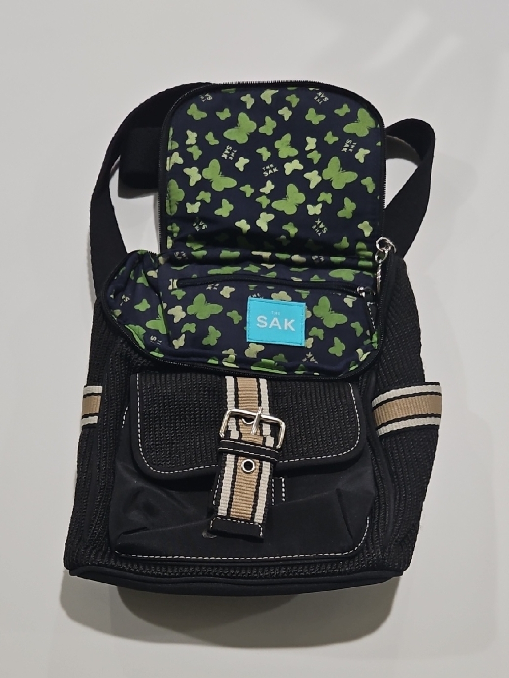The Sak Black Belt Bag with Green Butterfly Lining Backpack Purse. EUC